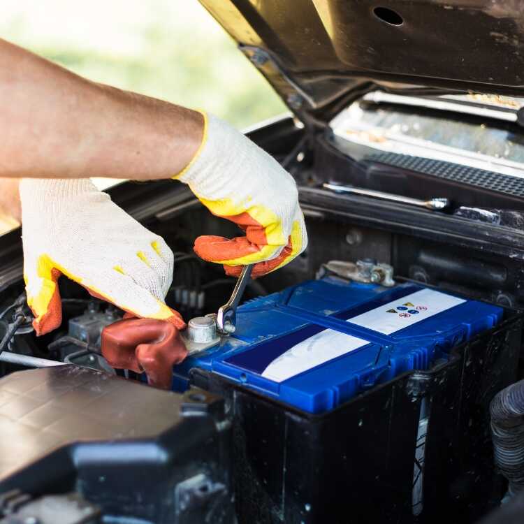 Top Batteries for Nissan Patrol a technician check the car battery